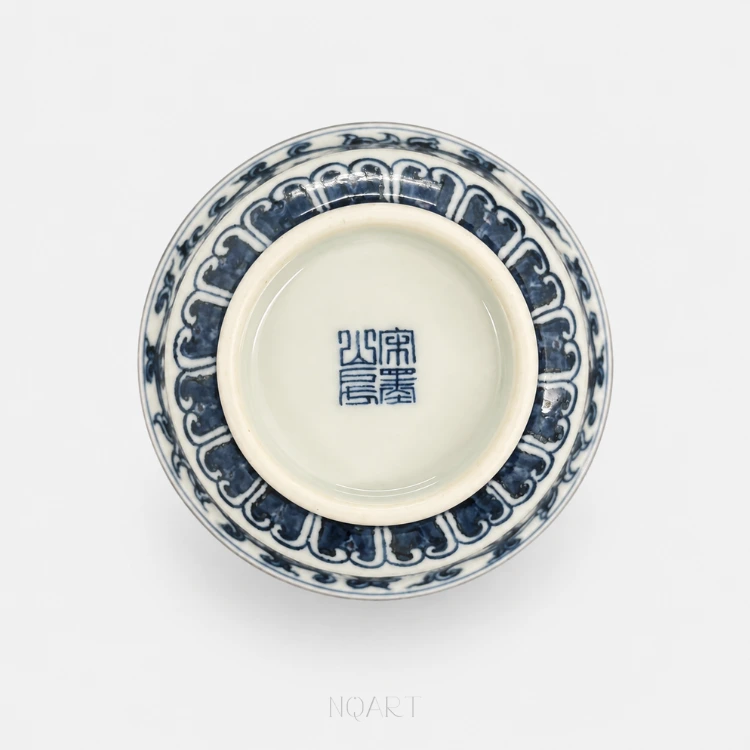 Where the potter signed — a four-character seal in underglaze blue sits in the middle of the base, with lotus petals banded around the outside.