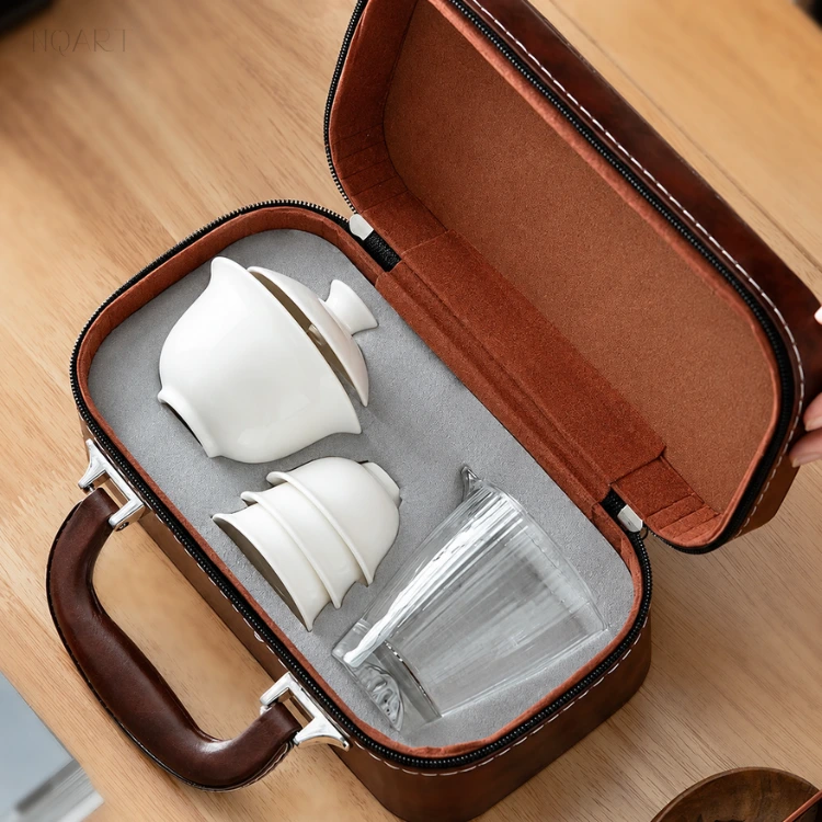 Looking down into the compact travel tea set case, the gaiwan, three stacked cups and the pitcher fill it without a millimetre to spare.