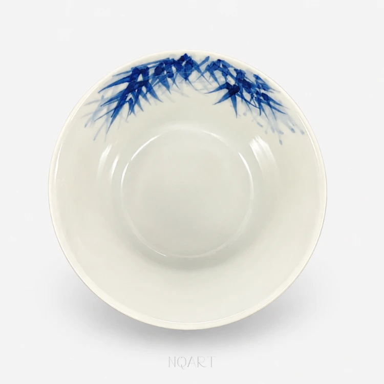Nothing is painted on the inside at all — the whole interior is bare white, with the bamboo only just showing over the rim.