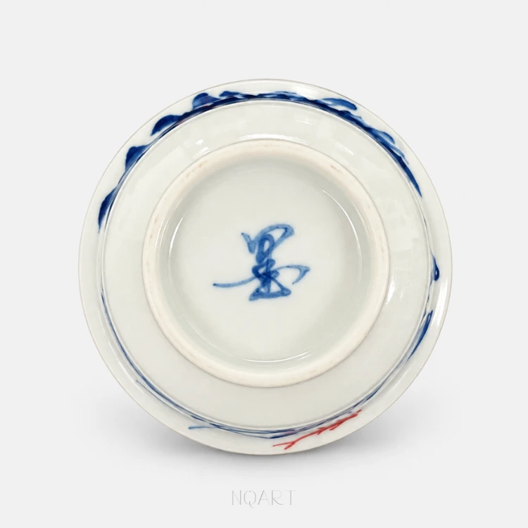 Turned over, the base shows the foot ring with a brush-written mark in underglaze blue inside it.