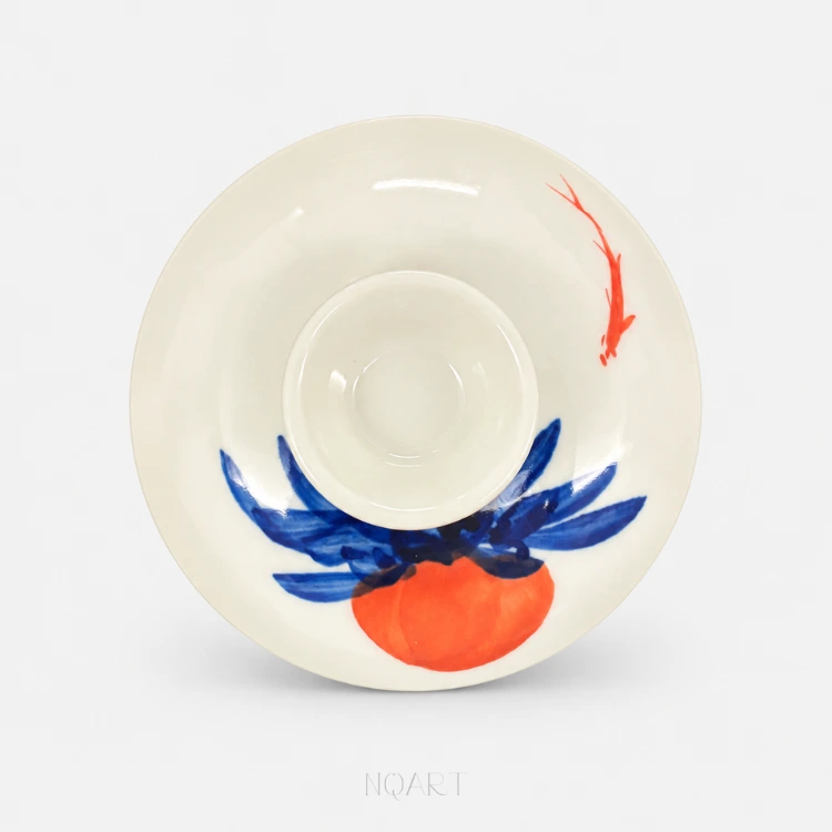 Flipped over, the lid shows its plain white underside, the painted face curving away at the rim.