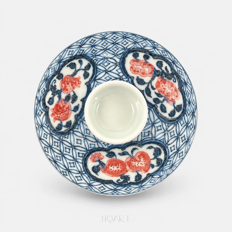 Looking down at the lid, three cartouches sit evenly round it with the plain knob at the centre and pomegranates in each.