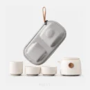 NQArt minimalist white ceramic travel tea set with two cups and portable EVA case.