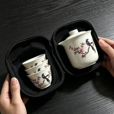 Zipped open, the case shows the stackable cups nested in one half and the pitcher in the other, both held in recesses cut to their shape.