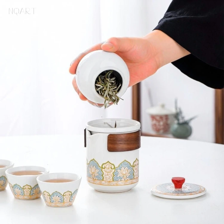 On its side, the tea caddy tips the leaf straight into the brewing cup below — no spoon, no scooping.