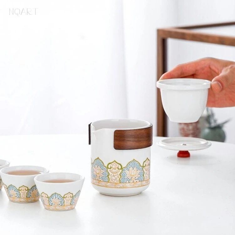 Out of the pot comes the tea strainer basket, the leaf held inside it and the tea left behind in the body below.