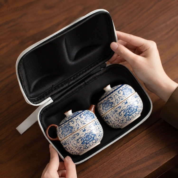 Both halves open, the travel tea case shows two moulded seats — the pot in one, the caddy in the other, each held by its own shape.
